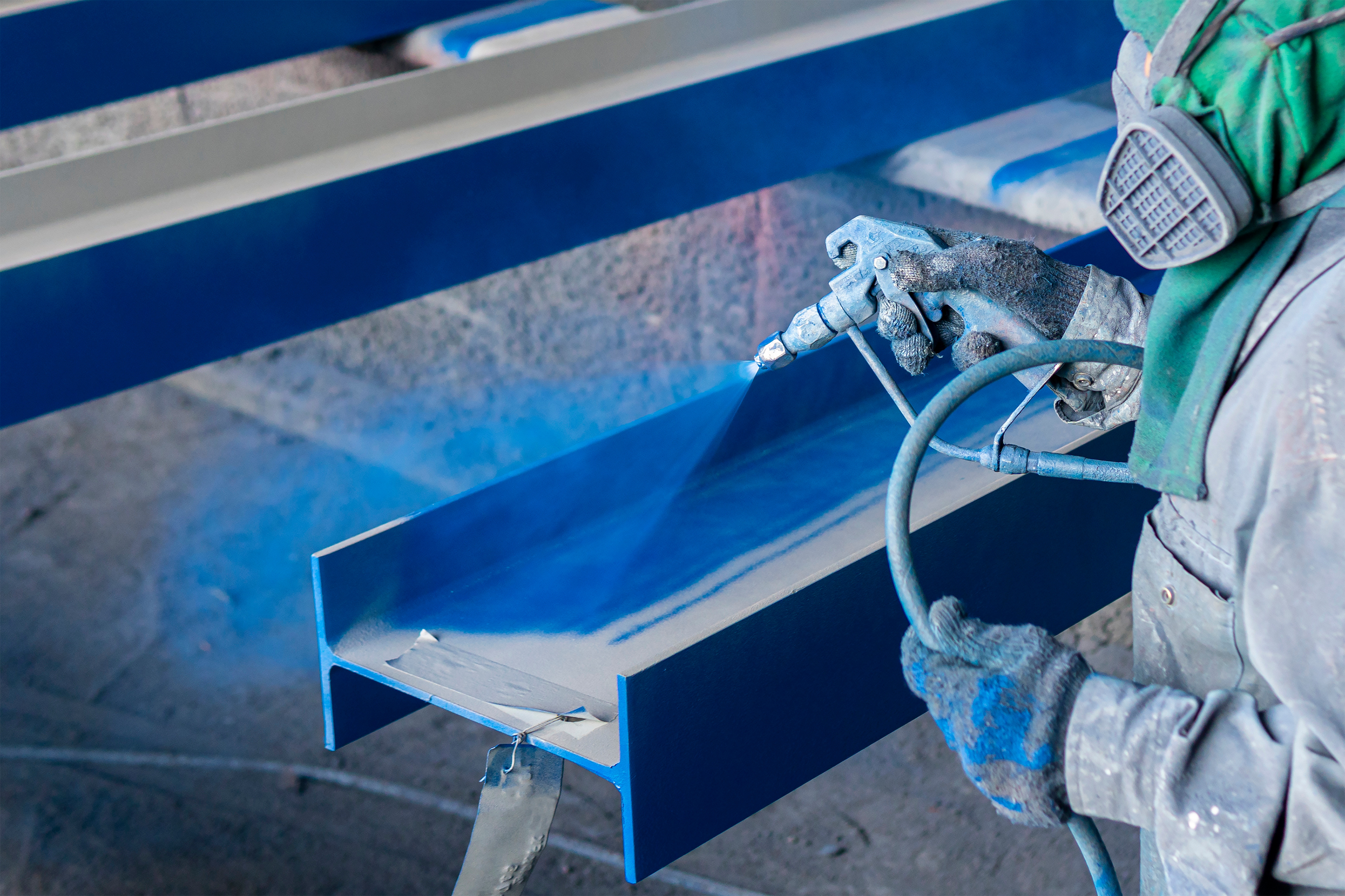 Steel beam being coated